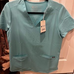 Figs size small casma top and Livingston pants in neon blue.